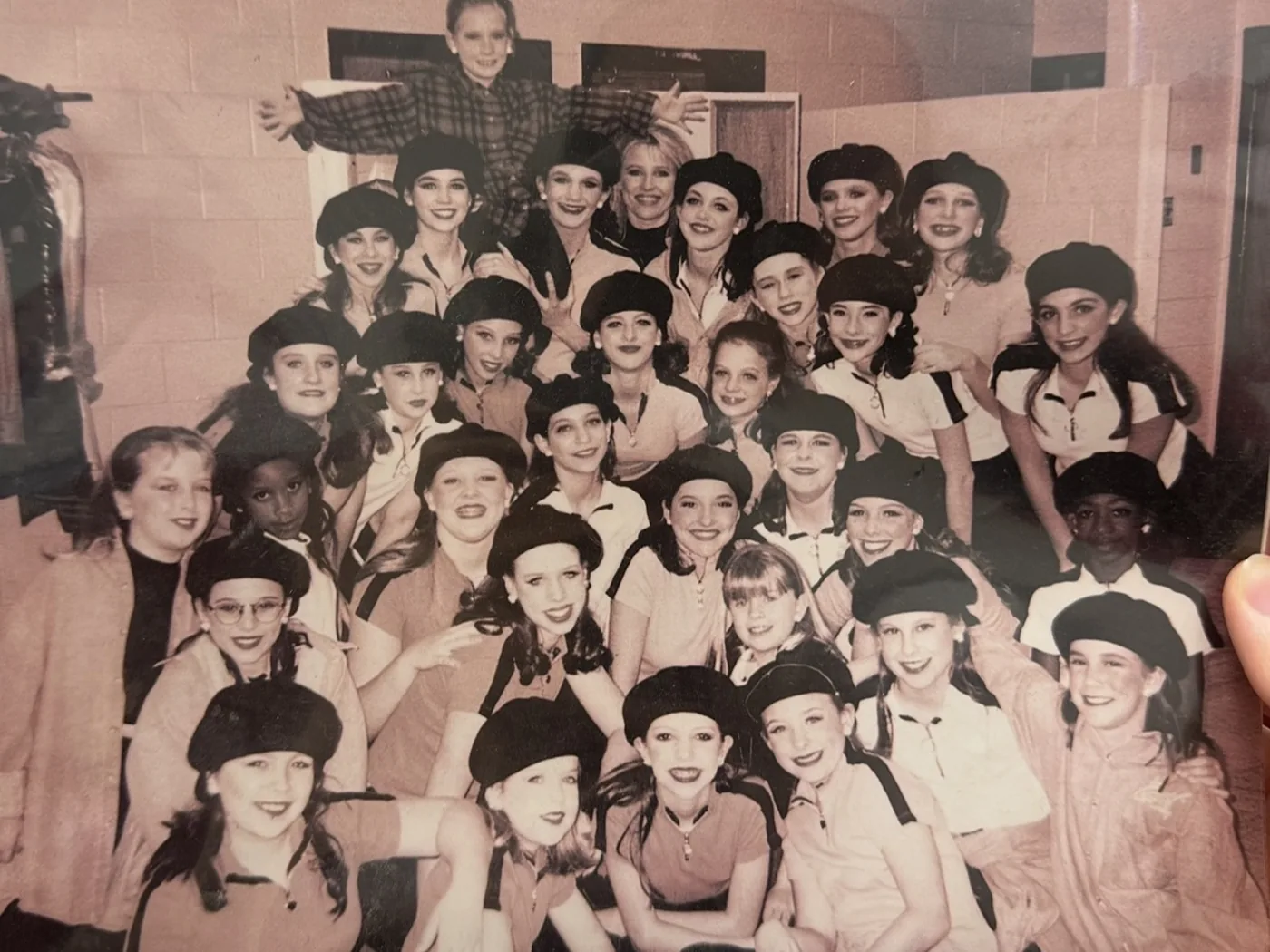 An early Encore company photographed together in berets, from the studio's first years