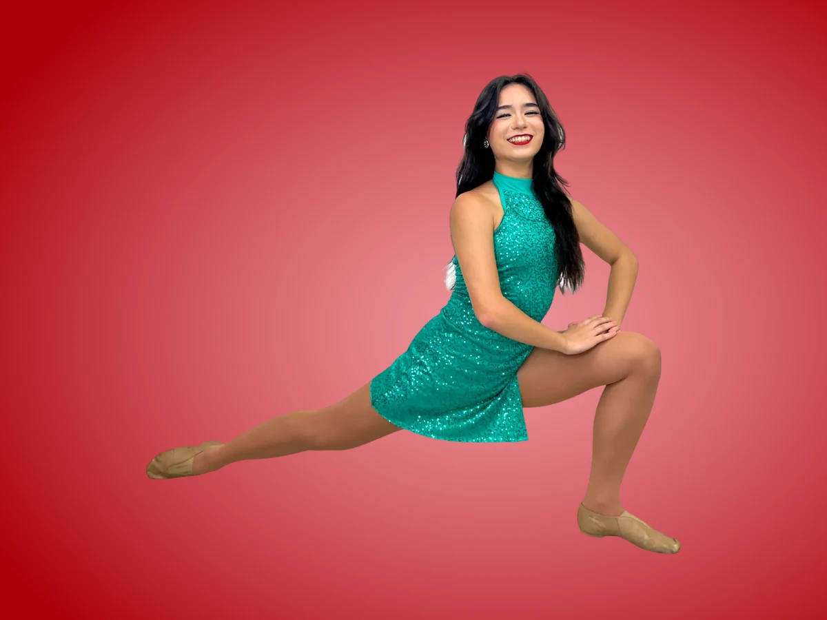 Adult dancer in a teal sequin dress in a contemporary floor pose