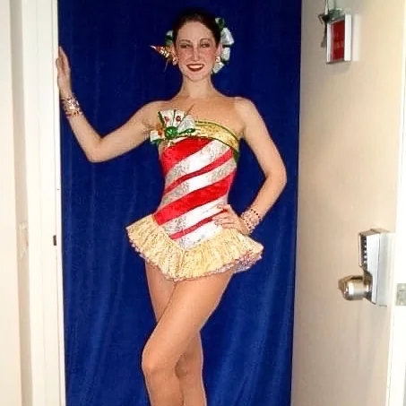 Emily Stacks in her Radio City Rockettes candy-cane costume backstage