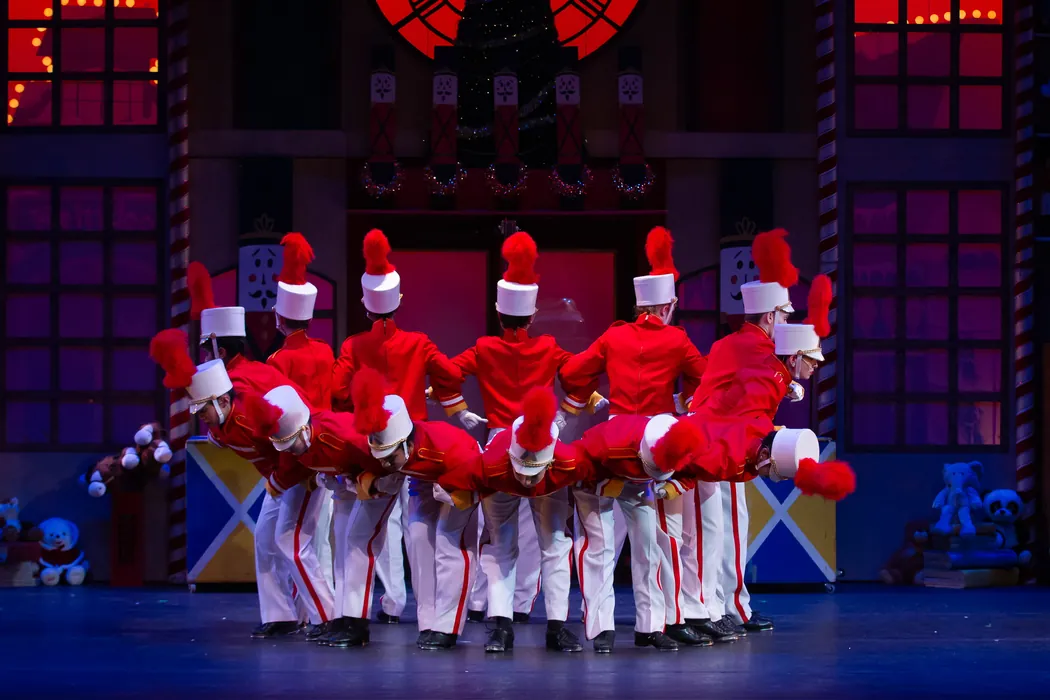 ETAP dancers in toy soldier costumes lined up across the stage